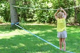 A Beginner S Guide To Backyard Slacklining With Kids Backyard Activities Slackline Beginners Guide