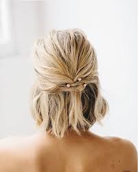 Gather the hair in a tight tail, and then make a bun with a donut: 50 Best Wedding Hairstyles For Short Hair That Are Perfect For 2020