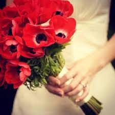 The reception is a romantic wonderland of florals — you can see the tabletops decorated with a variety of blooms, ranunculus, peonies, garden roses, italian ruscus and more. Oriental Poppy Bouquet Gorgeous Reds For The Girls Spring Wedding Flowers Red Bouquet Wedding Red Wedding Flowers