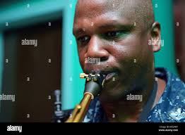 PUERTO CORTES, Honduras. (March 15, 2018) Lt. Marcus McDonough and Hospital  Corpsman 1st Class Adrian Weldon, assigned to Navy Environmental and  Preventative Medicine Unit TWO, prepare a BG-Sentinel mosquito trap outside  the