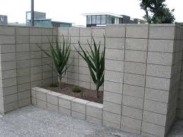 You can start by arranging several cinder blocks on your front yard. Painted Cinder Block Garden Wall Novocom Top