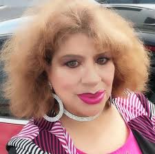 Monk parrots gathering twigs for their nest near main entrance