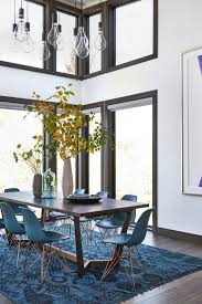 Hardwood is by far the most popular flooring type for dining rooms, but many of those incorporate an area rug as well. How To Find The Right Rug Size For Your Kitchen Or Dining Room Carpet One Floor Home