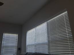 However, they're made from synthetic materials, which makes faux wood blinds more economical than wood blinds. Curtains Over Wood Blinds