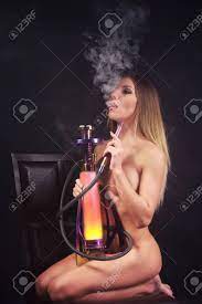 Naked Woman Smoking Hookah Stock Photo, Picture and Royalty Free Image.  Image 47459371.