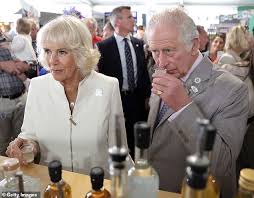 Prince Charles is given a lick on the ...