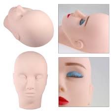 applying makeup on a mannequin s head