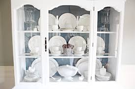 Hang the plates on the wall above the hutch or set tea cups on a shelf in the hutch if you want to display your china in a new way. Styling A Dining Room Hutch Bower Power