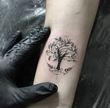 Black ink small tree of life tattoo on wrist. Tree Of Life Tattoos