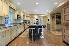 Notice that the backsplash is a mix of both light, medium and dark tones, which is a great way to transition a high contrast look. 43 Kitchens With Extensive Dark Wood Throughout Home Stratosphere
