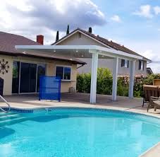 Custom patio cover that wraps around the house. Roof Mounted Alumawood Patio Cover Aluminum Patio Covers Covered Backyard Covered Patio