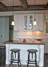 Looking for modern white kitchen cabinet ideas? Rustic Farmhouse Kitchen Featuring White Shaker Cabinets Modern Farmhouse Kitchens Farmhouse Style Kitchen White Kitchen Rustic