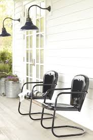 Phi villa metal patio outdoor dining chairs set of 2 stackable bistro deck chairs for garden backyard lawn support 300lb, black. Rejuvenation Take It Outside Snappy Black Metal Retro Inspired Chairs Amazing Outdoor Sconces Metal Lawn Chairs Metal Patio Chairs Metal Outdoor Chairs