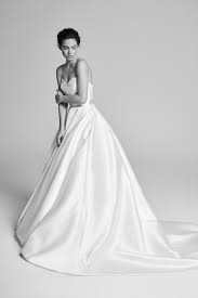 Clean ball gown with deep v neckline. Wedding Dress Styles By Designer Suzanne Neville