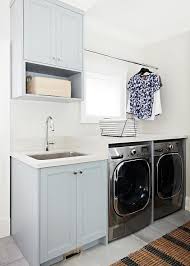 If you must wash jute items, hand wash separately in cool water using a mild soap. Pale Gray Laundry Room Cabinets With Striped Jute Rug Transitional Laundry Room