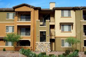 Maybe you would like to learn more about one of these? New 3 Story Condominium Complex In Gold And Tan Stucco With Desert Stock Photo Picture And Royalty Free Image Image 5139817