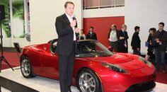 Tesla Motors Ceo Elon Musk Alongside First Generation Roadster Tesla Motors Elon Musk Tesla Elon Musk