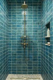 A design in which the shower stall wears different tiles from the rest of the bathroom is common and it actually distracts the eye from the size of the room. 24 Creative Blue And Green Tiled Bathrooms Best Tiled Bathroom Ideas