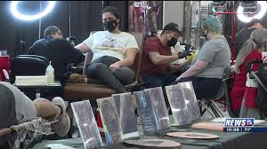 Tattoo artists managing stricter sanitation, capacity restrictions to  remain open during pandemic