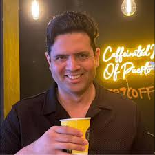 Joe Walsh, holding his Gibson '59 Les Paul Standard, and Don Felder with a  '58 'Burst — pictured alongside guitar dealers Brian Brock and Tony Dukes  in Houston, Texas, during an Eagles