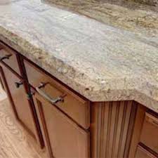 Cornice details, vintage pulls and cream granite on the counters and the backsplash all combine to create a very elegant feel to this kitchen, creating a. Pairing Countertops With Cherry Cabinets The Kitchen Bath Experts Kitchen Remodeling In Denver Co
