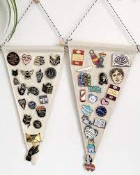 Here S How To Turn Your Enamel Pins Into A Design Statement Enamel Pin Display Pins Badge Display Pin Collection Displays