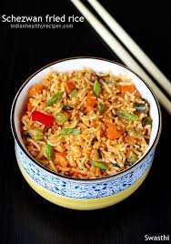 Sauteed meat and vegetables in spices and mixed with egg and pre cooked white rice.fried rice. Schezwan Fried Rice How To Make Schezwan Rice Swasthi S Recipes