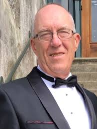 Longtime Oscoda resident and Legendary saxophonist JIM SAPP receives an  AWARD from fellow band mate, Tom Neuenfeldt, during his presentation  ceremony at last Monday's Tawas Community Concert Band's Christmas  performance. Jim has