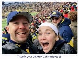 Here is our patient, Lola Boynton, and her dad having fun at the U of MI  vs. Ohio State football game. Her mom, Kate, won our drawing for the  tickets. A special