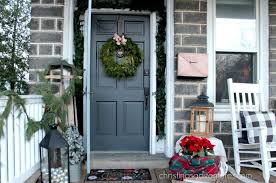 Birch log and pine branch centerpiece. Farmhouse Christmas Decorating Ideas Christina Maria Blog