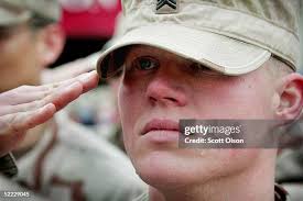 Laura Ludolph hugs her boyfriend, Sgt. Dave Wetherell of the Illinois...  News Photo
