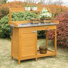 This potting bench is a very cute addition to your outdoor area. Outdoor Garden Organizer Stainless Steel Top Potting Bench Storage Cabinet Q C Home