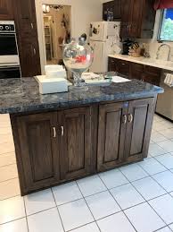 complete dark wood kitchen corian