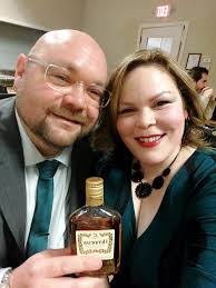 Make the background seem like I am in a hotel please and add a bottle of  Hennessy if possible