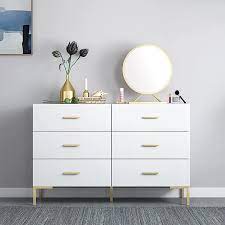 Six drawers run smoothly on metal glides, offering easy access to storage for clothing and bedroom items. 47 Nordic White Bedroom Dresser 6 Drawer Accent Cabinet In Gold