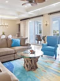 This gorgeous round coffee table will add a rustic, natural touch to any design. Glass Top Driftwood Tables Shop The Look Coastal Decor Ideas Interior Design Diy Shopping