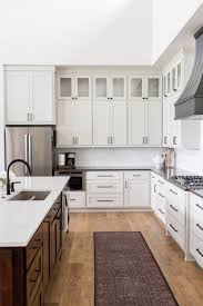 Double Height Ceilings Vintage Runner Large Island Sink In Island Dark Island Cabinets Dark Interior Design Kitchen Kitchen Design Black Countertops