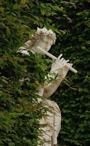 Summer Style Garden Statue Like Pan Playing Flute In The Garden Wonderful Style For Elegant Gardens And Placed A Garden Statues Garden Art Secret Garden