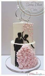 Wedding Rings Top Off The Cake With This Idea Spring Wedding Cake Wedding Cakes With Flowers Pretty Wedding Cakes