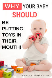 Why Your Baby Should Be Putting Toys In Their Mouth Your Kid S Table Before Baby Infant Activities Mom And Baby