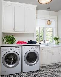 Just because it's a laundry room doesn't mean you don't need some window treatments. White Laundry Room Cabinets With Canopy Designs Globe Branches Chandelier Transitional Laundry Room
