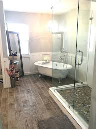 This bathroom features a large skylight window, allowing for fresh air and natural sunlight to flood into the room. Clawfoot Tub Bathroom Design Ideas