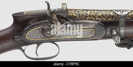 A Persian, gold-inlaid percussion rifle, 19th century, Round, rifled Damascus barrel in 17 mm calibre with cannon muzzle. The surface of the barrel inlaid with knotted ribbon ornaments and arabesques in gold.