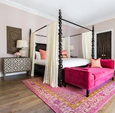 Hot pink bedroom decorating ideas zebra bedroom decor animal print decorating ideas see our entire gallery of 20 hot pink bedrooms that would look great in your home. Hot Pink Settee At End Of Black Canopy Bed Mediterranean Bedroom