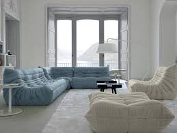This room has a single, small and round ottoman matching the comfy, welcoming, and roomy chair. Ligne Roset Togo Small Sofa By Michel Ducaroy Chaplins