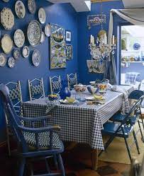 Designed by studio db, this dinning room is such a nice blend of warm and cool tones. Blue Country Dining Room Dining Room Decorating Ideas Lonny