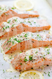 Oven Baked Salmon With Lemon Cream Sauce Baked Salmon Lemon Seafood Dinner Oven Baked Salmon