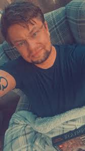 I think it was a book but I can't remember. It's about two lads back  packing staying at a hostel one of them is dying. A women who's pregnant  and flees but