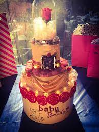 Beauty And The Beast Diaper Cake On Top Of A Hatbox Full Of Presents Bstarz Beauty And The Beast Beauty And The Beast Party Wedding Cake Disney Princess