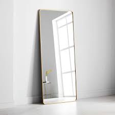 Putting a contemporary twist on a vintage design, this leaning mirror brings both fashion and function. Modern Streamline Rounded Edge Floor Mirror